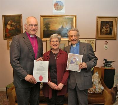 Sue Clarke-Berry with Bishop Peter (left) and Revd. Eric Chambers (right)
Bishop Peter is holding  Sue's Pastoral Worker Licence and Revd. Eric Chambers her  baptism certificate.
